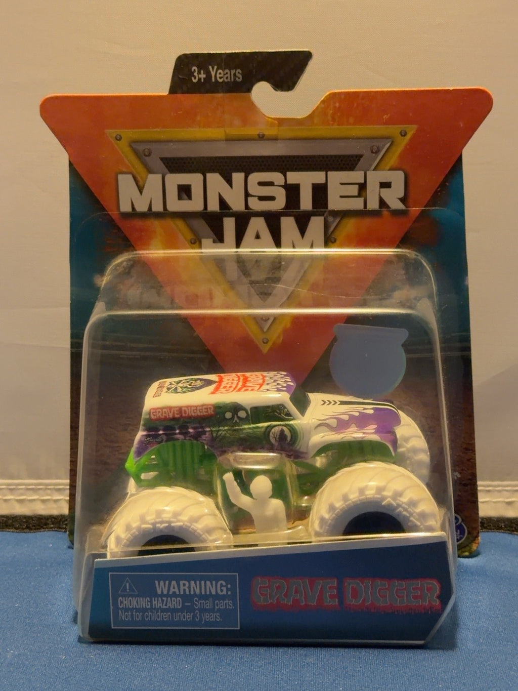 2019 Grave Digger Inverse Trucks white and purple 1:64 truck with white figure, front