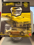 2026 Hot Wheels Premium Vintage Racing Nissan Skyline GT-R BNR32 GOLD CHASE 0/5 — front view