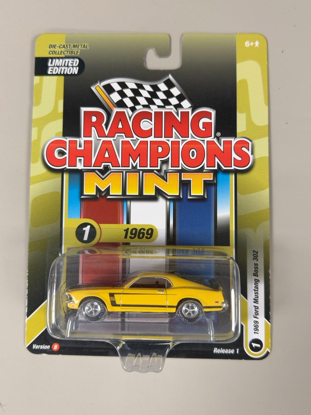 2025 Racing Champions Mint 1969 Ford Mustang Boss 302 Yellow Release 1 B — front of original packaging