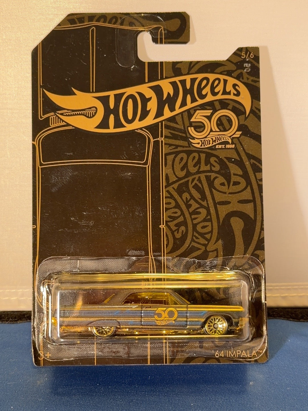 Original front photo 2018 Hot Wheels 50th Anniversary Black and Gold 64 Impala FRN38 5/6