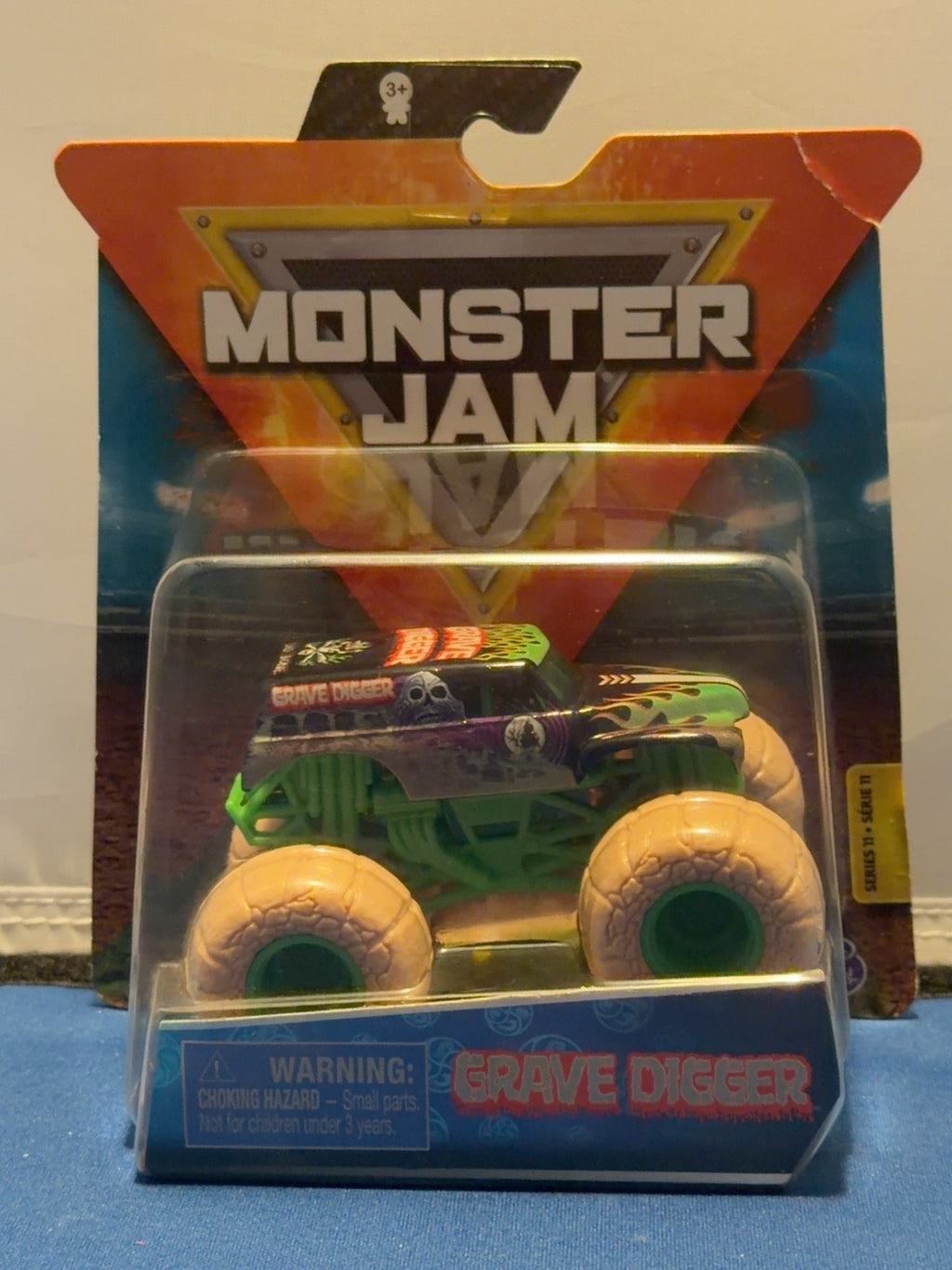2020 Grave Digger Elementals Series 11 stone tires, front with creased upper-right card corner