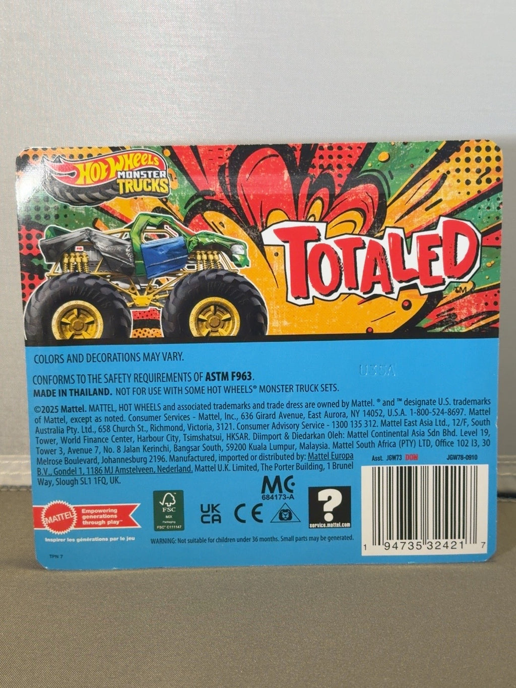 Original back photograph of Hot Wheels Monster Trucks Totaled packaging