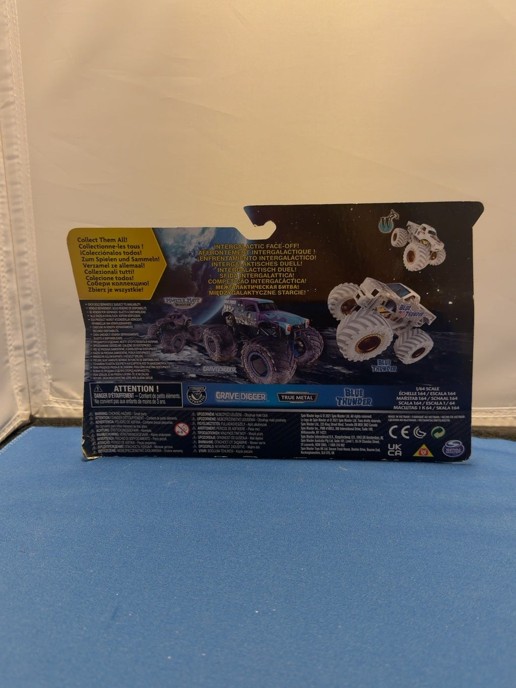 Monster Jam Gears and Galaxies Blue Thunder vs Grave Digger back