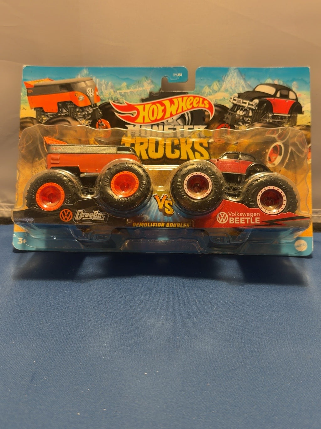 Front of exact VW Drag Bus and Volkswagen Beetle set; slight bottom-left card bend