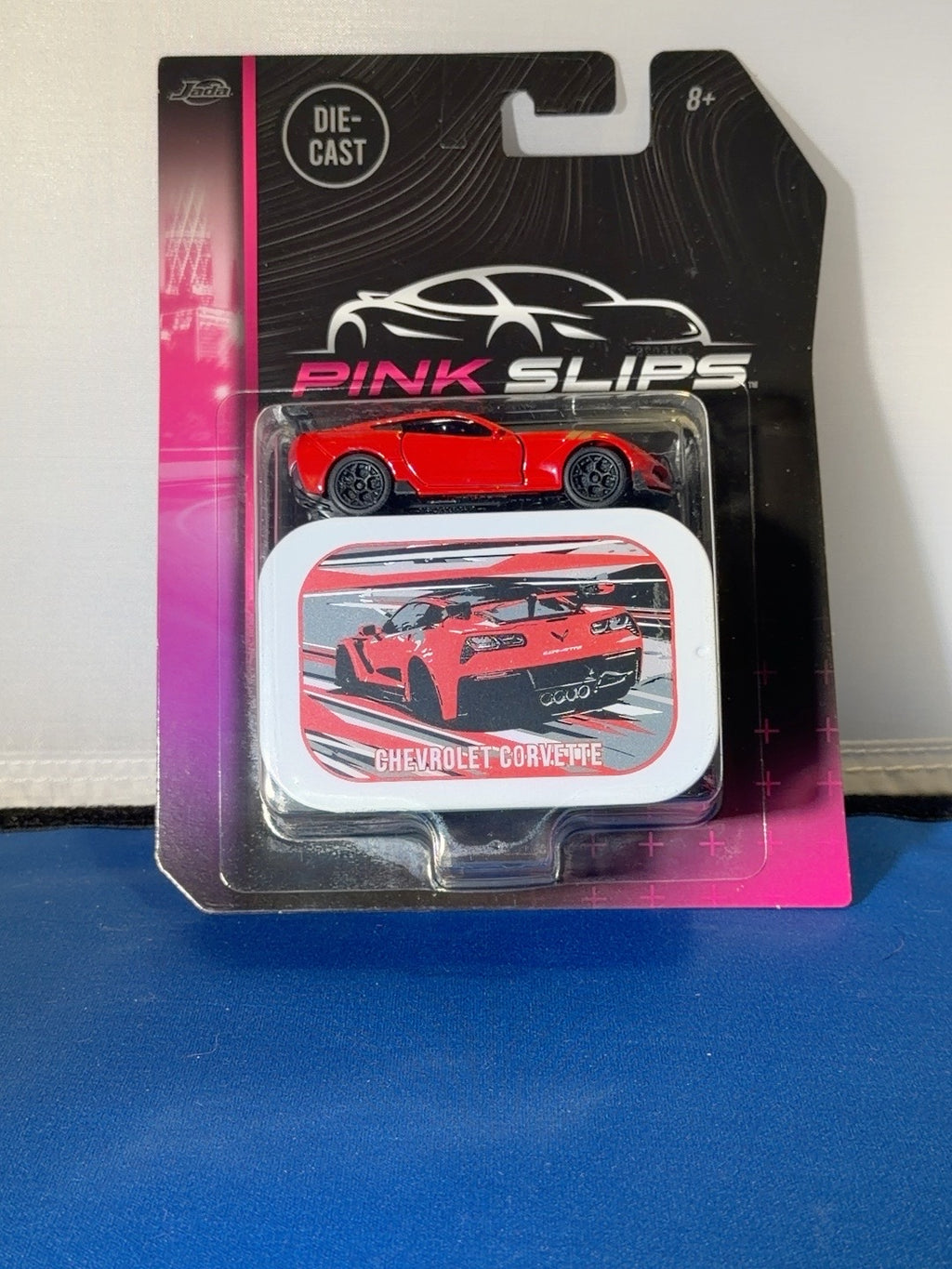 Jada Pink Slips red Chevrolet Corvette with collector tin front original photo