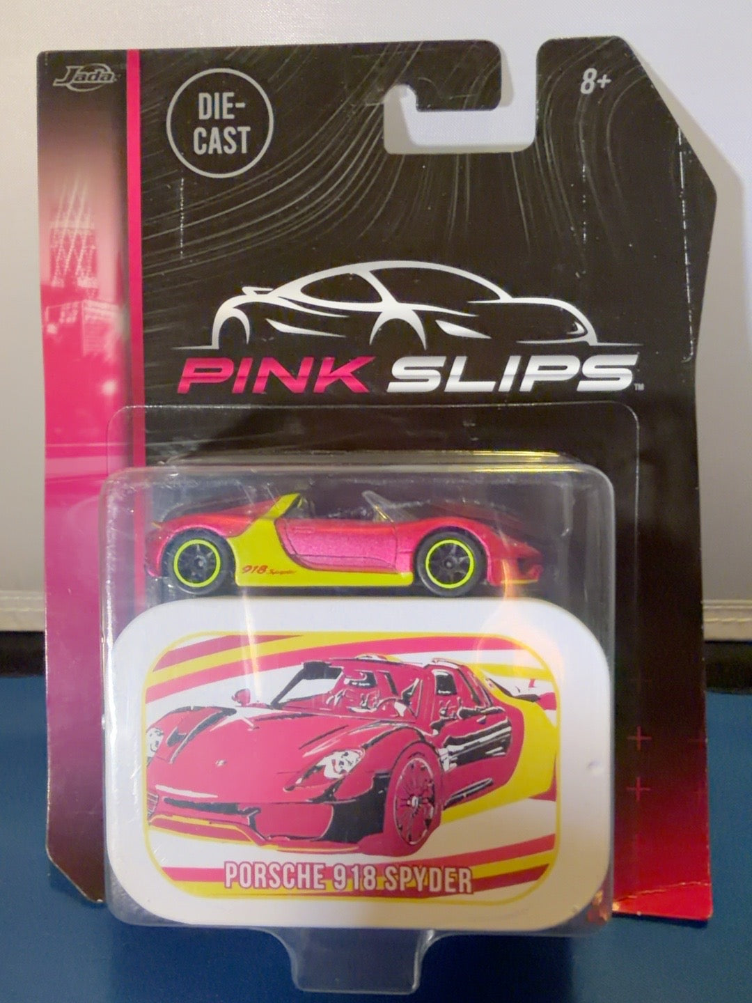 Jada Pink Slips Porsche 918 Spyder Pink Yellow 1:64 with Collector Tin Sealed — product photo 1